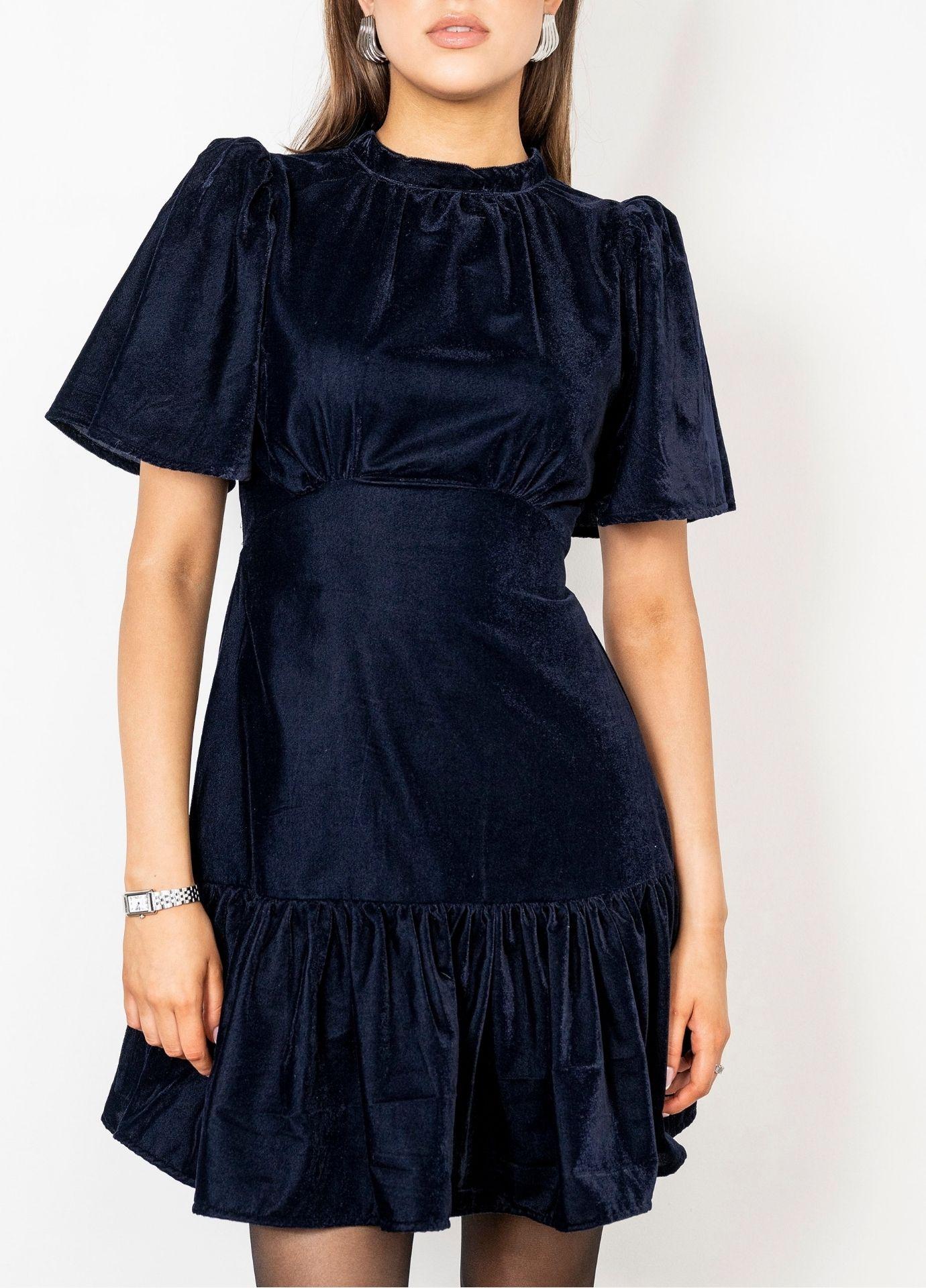 Jolie Dress Velvet Blue Sapphire in a close front view, showing the high gathered neckline and the short flared sleeves in deep blue velvet.